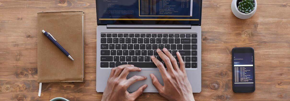 top down view: Man working with a laptop